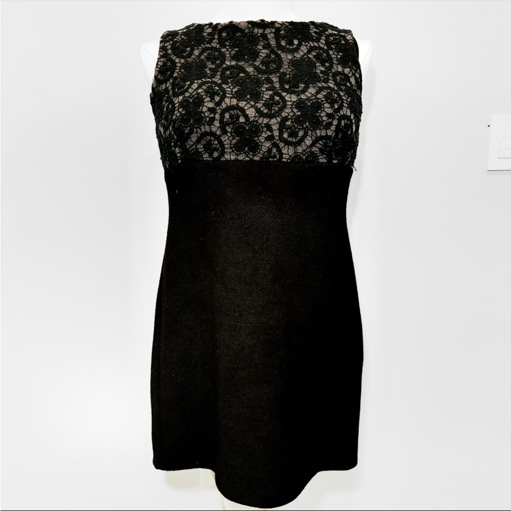Givenchy Paris “Little Black Dress” with textured wool and intricate embroidery.